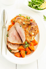 Baked turkey thigh with pumpkin. view from above.