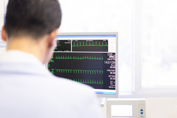 Fototapeta na wymiar The doctor check heart rate and pulse of patient by running test for protect the heart attack.