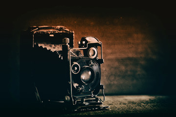 very old black retro camera, retro toned
