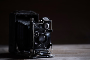 very old black retro camera, retro toned
