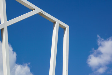 metal structure with a ladder on a background of blue sky