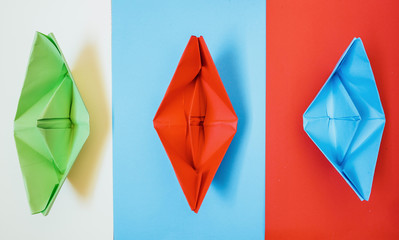  colorful paper boats, paper ships on colorful background