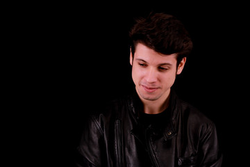 Obraz premium Smiling man in front of black background