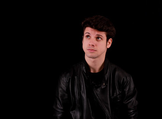 Obraz premium Thinking man standing in front of black background