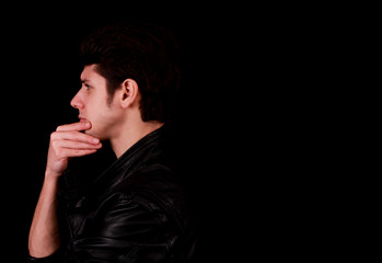 Fototapeta premium Thinking man in front of black background