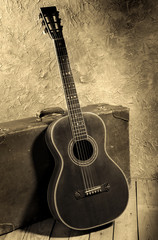 Fototapeta na wymiar vintage blues guitar with baggage