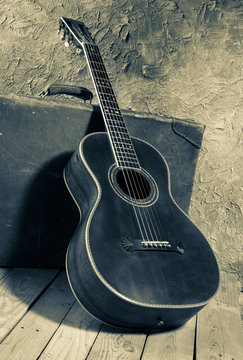 vintage blues guitar with baggage