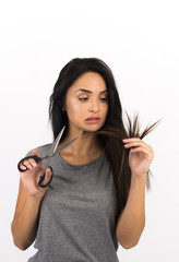beautiful girl with very long hair healthy and damaged hair concept holding comb and scissors  cutting dry and damaged hair