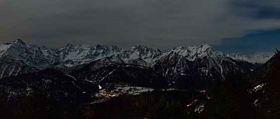 Panoramic view of Swiss Alps at moon light.