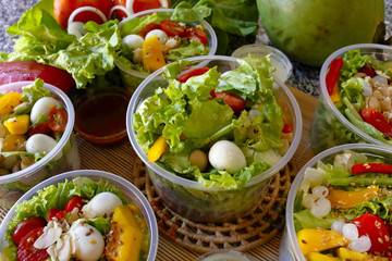 Fresh vegetable salad in an open plastic bowl packing
