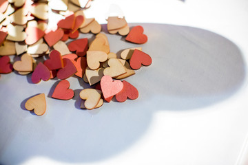 A lot of colorful heart on white table, sign of wedding and valentine’s day, symbol of love, image for background, wallpaper,copy space