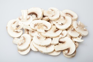 Sliced Champignons Mushrooms on Grey Background