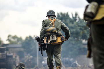 Historical reenactment of soldiers during the Second World War, view from the back