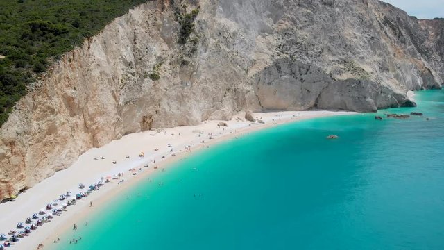 Aerial - Dream beach from above. Porto Katsiki bay with steep white cliffs
