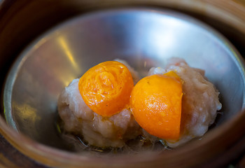 Chinese appetizer, Dimsum, streamed cuisine on bamboo basket container, traditional cuisine