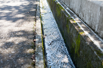 Clean water streaming in concreate made small drainage