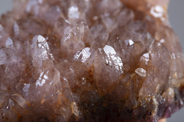 Natural Druse of amethyst on a white background stone