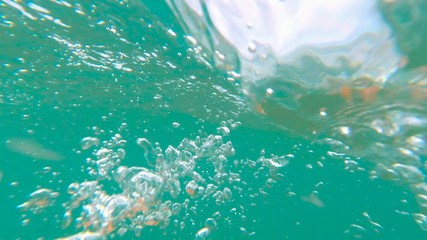 Fototapeta na wymiar Photo underwater sea with bubbles in the summer