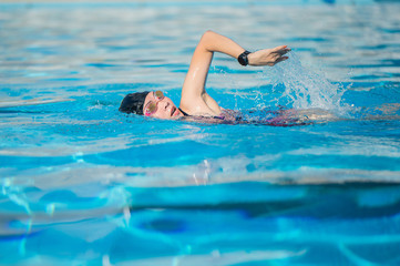 woman swimming in the swimming pool