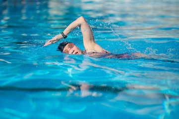 woman swimming in the swimming pool