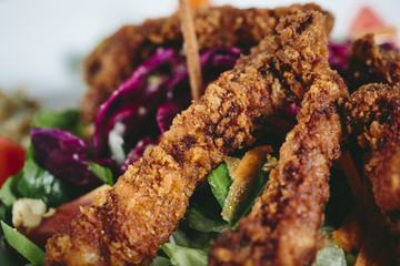 Delicious salad with chicken, nuts, egg and vegetables.