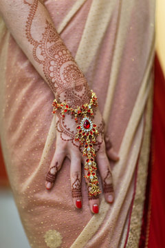 mehendi painted on the hands of girls