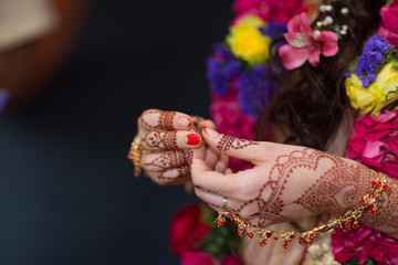 mehendi painted on the hands of girls