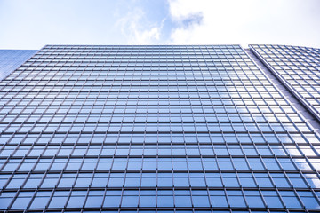 underside panoramic and perspective view to steel blue glass high rise building skyscrapers, business concept of successful industrial architecture