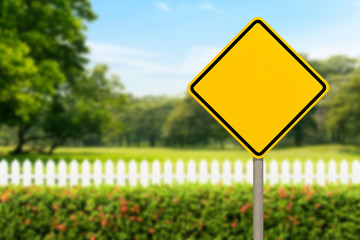 Blank yellow road sign or Empty traffic signs on scenic view of the park with cloudy blue sky...