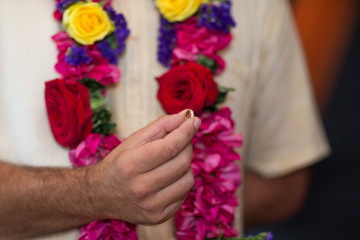 elements of Vedic wedding wearing rings close up