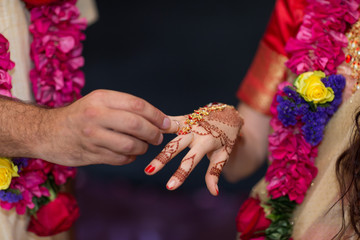 elements of Vedic wedding wearing rings close up