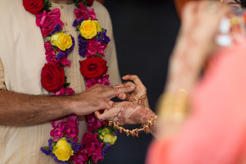 elements of Vedic wedding wearing rings close up