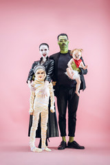 Halloween Family. Happy Father, Mother and Children Girls in Halloween Costume and Makeup. Bloody...
