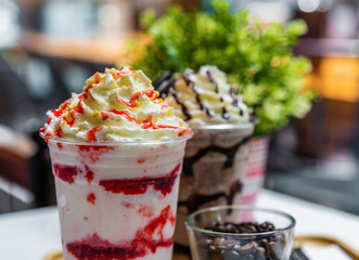 close-up strawberry and chocolate frappe with whipped cream