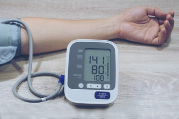 Man is taking care for health with hearth beat monitor and blood pressure. . Health concept