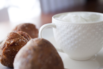 Morning cappucino with delicious muffins