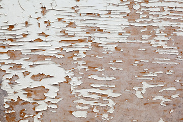 texture of wooden background of weathered wood with faded white paint