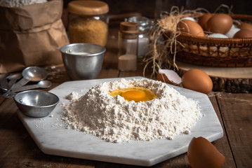 The ingredients for cakes and preparing material for making bread.In the atmosphere of farm and rural style.