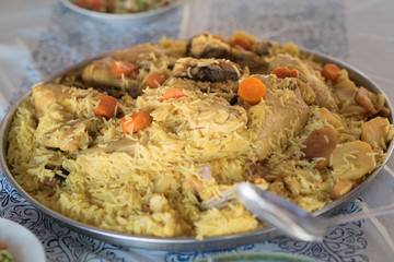 Maqluba traditional Arab food.The dish includes meat, rice, and