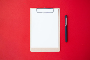 Vintage office space paper list mockup flat lay on red table top background texture concept white blank note on workspace desk, pastel plan note 2019, business valentine back to School.