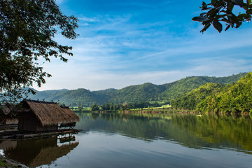 The wooden raft in the water reservoirs and mountain views.