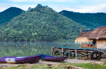 The wooden raft and Kayak in the water reservoirs and mountain views.