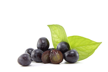 Fresh black grapes on white