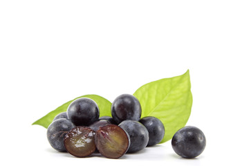 Fresh black grapes on white