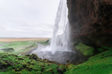 Seljalandsfoss waterfall and pathway around it, Iceland