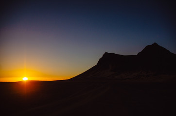 Sunset on the Black Desert, blue and orange sky