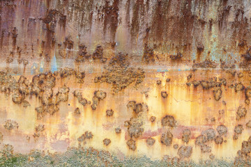 Rust covered weathered iron steel metal background with rusty peeling blistering paint