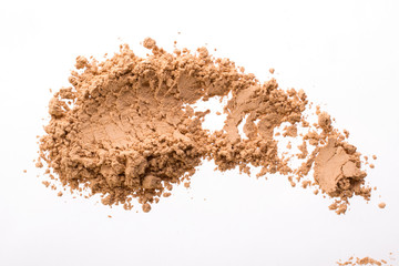 Smear from dry yellow cosmetic clay. Texture of  makeup powder - blush or eyeshadow. Isolated on a...