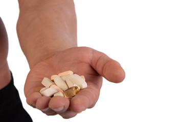 Sports supplements and attractive athletic man. White background.