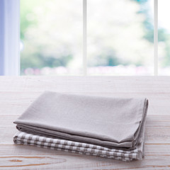 Napkin on the table and kitchen window blurred background